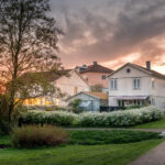 Sunset lights the houses in Molndal, suburb Gothenburg city, Gotland, Sweden